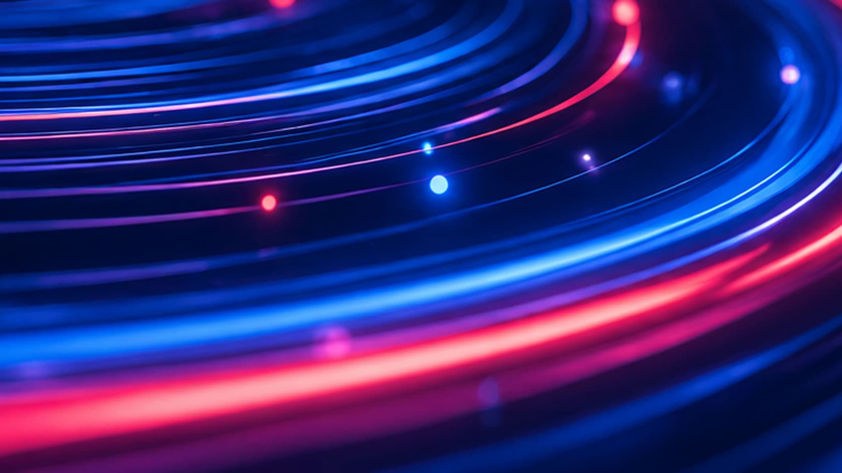 Abstrakte blaue und pinke Lichtspuren als Symbol für modernes Endpoint Management