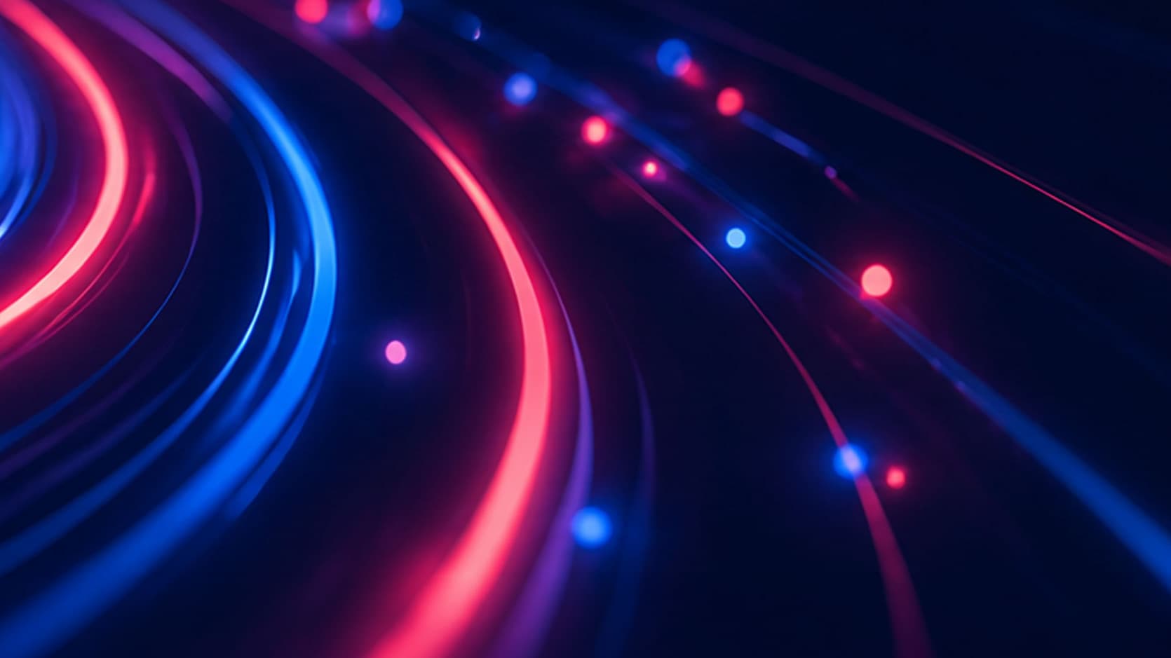 Abstrakte blaue und pinke Lichtspuren auf dunklem Hintergrund